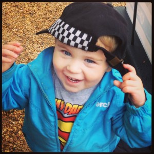 toddler in police hat dressing up